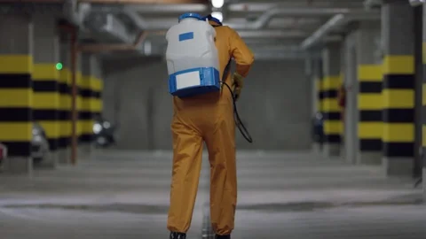 Frontline Worker in Full Hazmat Suit Disinfects Coronavirus Contaminated Car Stock-Footage 129200353