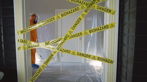 Frontline Worker in Full Hazmat Suit Enters Coronavirus Contaminated Room Stock Footage 129200452