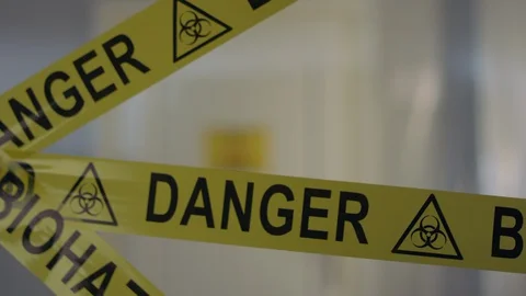 Frontline Worker in Full Hazmat Suit Enters Coronavirus Contaminated Room Stock Footage 129200542