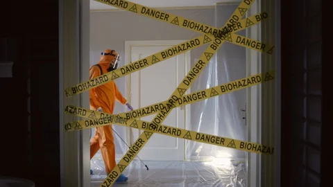 Frontline Worker in Full Hazmat Suit Enters Coronavirus Contaminated Room Stock-Footage 129201123