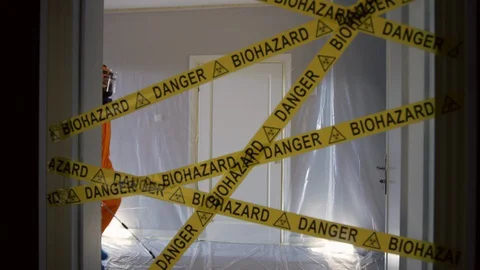 Frontline Worker in Full Hazmat Suit Enters Coronavirus Contaminated Room Stock-Footage 129201414