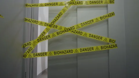 Frontline Worker Rips Biohazard Barricade Tape and Enters Coronavirus Stock Footage 129194259