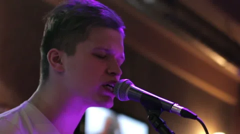 The frontman sings on stage Stock Footage 43755954