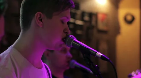 The frontman sings on stage Stock Footage 43756622