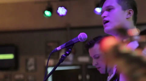The frontman sings on stage Stock Footage 43756901