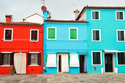 Fronts of the bright red, blue and turquoise houses, island of Burano, Italy Stock Photos