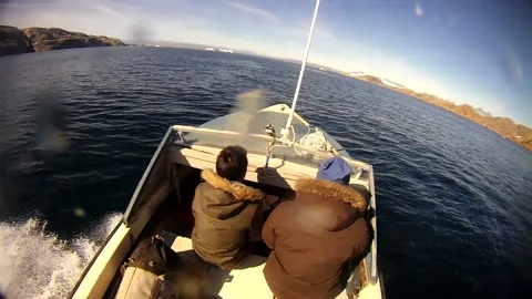 Frontside View of Speed Boat Whizzing Through East Greenland Fjord Stock Footage 233606894