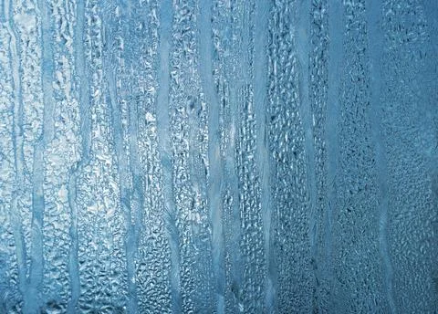 Frost and drops texture blue frosty natural pattern on winter windowpane C... 写真素材