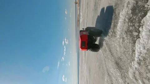 Frost-Bound Explorer. Rugged Vehicle Tackles Arctic Challenge. Vertical 9x16 FPV Stock Footage 263080960