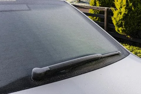 Frost on Car Rear Windshield with Rubber Wiper Blade and Heating Elements Stock Photos