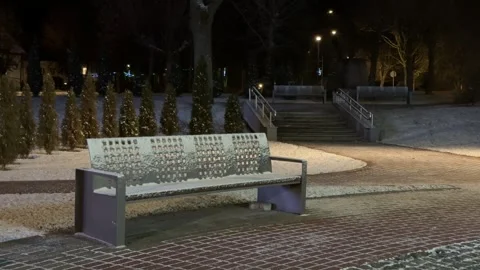 A Frost-Covered Bench in Empty Night Winter Park Video stock 297862182