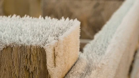 Frost covered fence post with visible ice crystals in winter Stock Footage 71023045