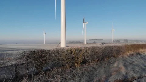Frost day drone shot of full height of wind turbine 库存影片 104920286