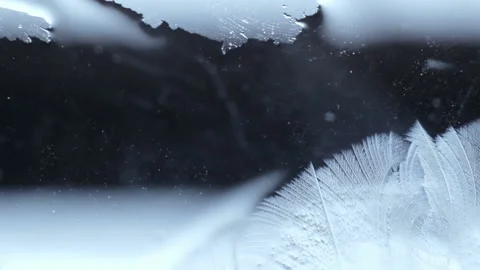 Frost draws a pattern on the glass Stock Footage 88448599