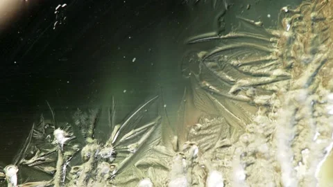 Frost draws a winter pattern on the glass. Great background for congratulations. Stock Footage 233429308