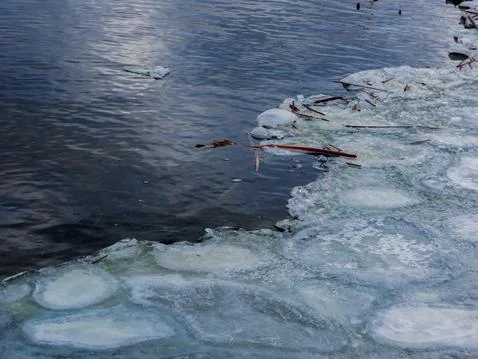 Frost froze the river in winter. Stock Photos