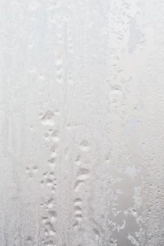 Frost pattern on window glass as background Stock Photos