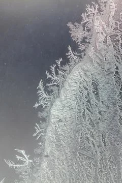 Frost pattern on window glass as background Stock Photos