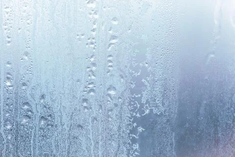 Frost pattern on window glass as background Stock Photos