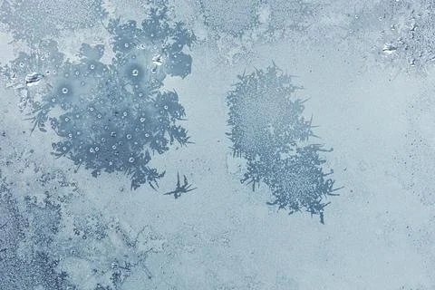 Frost pattern on window glass as background Stock Photos