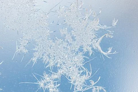 Frost pattern on window glass as background Stock Photos