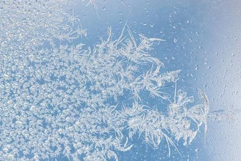 Frost pattern on window glass as background Stock Photos