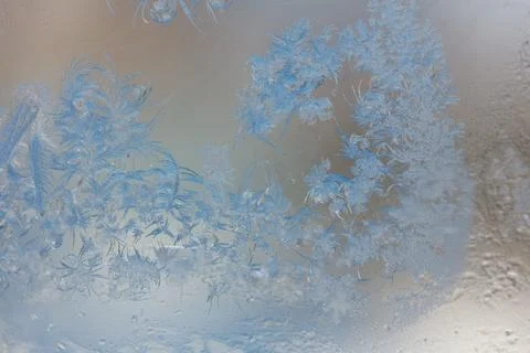 Frost pattern on window glass as background Stock Photos