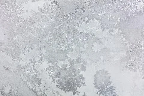 Frost pattern on window glass as background Stock Photos