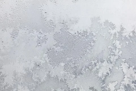 Frost pattern on window glass as background Stock Photos