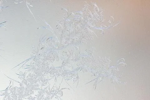 Frost pattern on window glass as background Stock Photos