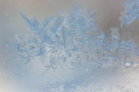 Frost pattern on window glass as background Stock Photos
