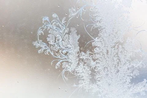 Frost pattern on window glass as background Stock Photos
