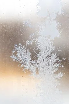 Frost pattern on window glass as background Stock Photos