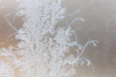 Frost pattern on window glass as background Stock Photos