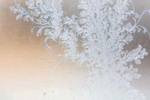 Frost pattern on window glass as background Stock Photos
