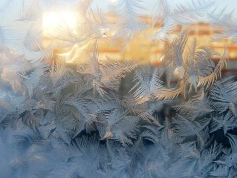 Frost Pattern on Window Glass in Sunlight Stock Photos