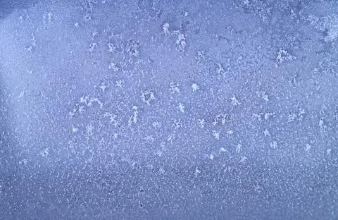 Frost patterns on frozen winter window as a symbol of Christmas wonder. Miste Stock Photos