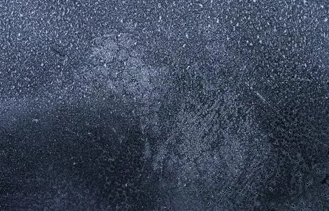 Frost patterns on frozen winter window as a symbol of Christmas wonder. Mis.. Stock Photos