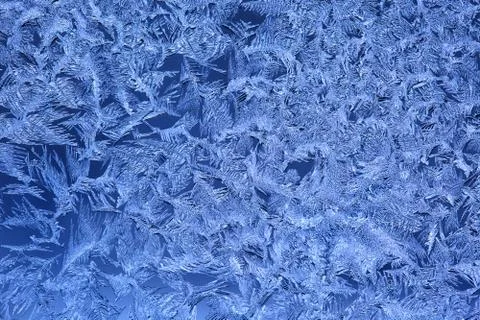Frost patterns on window glass Stock Photos