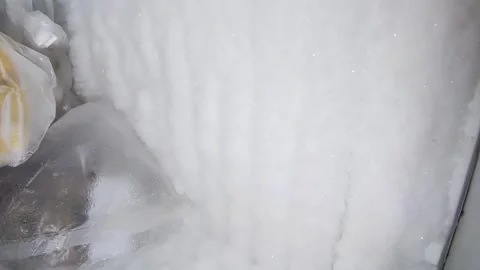 Frost in the refrigerator freezer. Stock Footage 314699474
