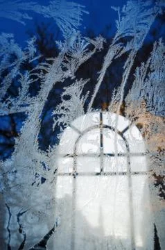 Frost on the window of the chapel Stock Photos
