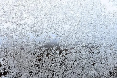 Frost on window pane in winter evening frost on window pane in cold winter... Stock Photos