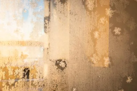 Frost in window at warm sunlight Stock Photos
