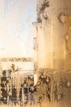 Frost in window at warm sunlight Stock Photos