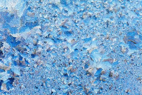 Frost on a window in winter Stock Photos