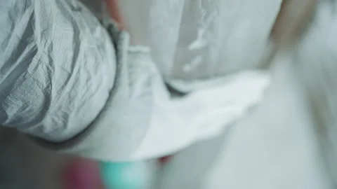 Frostcovered sleeve conceals vital forensic evidence. Investigator discovers Stock Footage 346470648