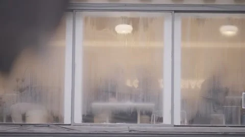 Frosted Cafe Window with Warm Interior Light Stock Footage 340546492