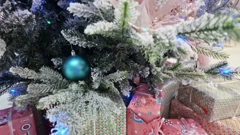 Frosted Christmas Tree Branches Above Wrapped Gift Boxes Stock Footage 346720957
