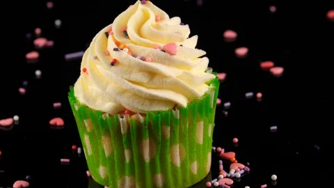 Frosted Cupcake, camera slow zoom out, black background Stock Footage 91030560