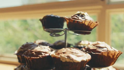 Frosted cupcakes on a display Video stock 274631922